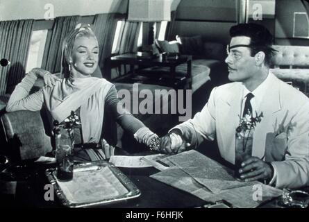 1953, Filmtitel: HOW TO MARRY A MILLIONAIRE, Direktor: JEAN NEGULESCO, Studio: FOX, im Bild: ALEX D'ARCY, MARILYN MONROE, Flugzeug, JET, RICH, DEKADENT, Augenklappe, halten Sie Hände, Getränke, Papier, lesen, liegend, POSIEREN, Freizeit, PRIVATFLUGZEUG. (Bild Kredit: SNAP) Stockfoto