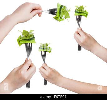 Satz von Wohn / Gabeln aufgespießt frischer grüner Salat isoliert auf weißem Hintergrund Stockfoto