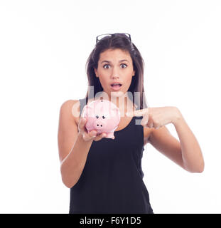 Junge Frau halten ein Sparschwein Stockfoto