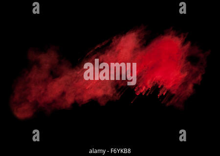 Einfrieren der Bewegung des roten Staub-Ex auf schwarzem Hintergrund Stockfoto