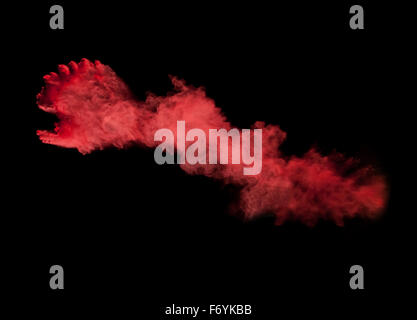 Einfrieren der Bewegung des roten Staub-Ex auf schwarzem Hintergrund Stockfoto
