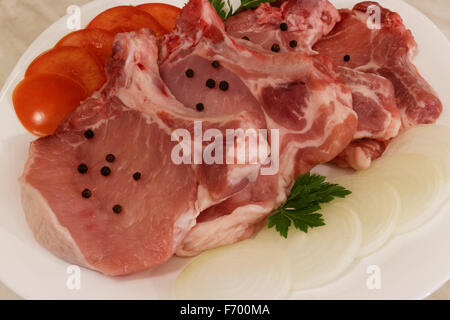 Rohe Schweinekoteletts Stockfoto