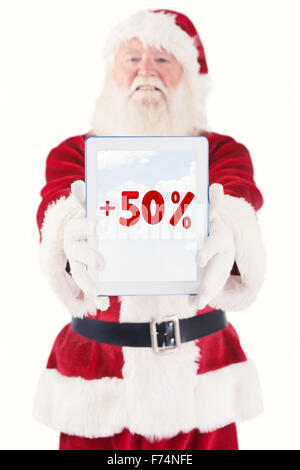 Zusammengesetztes Bild von Santa präsentiert einen TabletPC Stockfoto