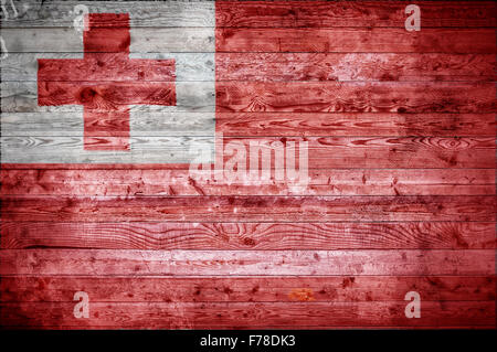 Ein bandtypischen Hintergrundbild der Flagge von Tonga auf Holzbrettern einer Wand oder Boden. Stockfoto