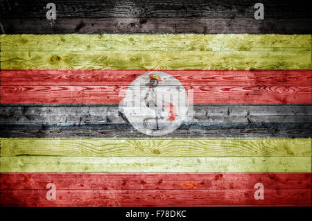 Ein bandtypischen Hintergrundbild der Flagge Ugandas auf Holzbrettern einer Wand oder Boden. Stockfoto