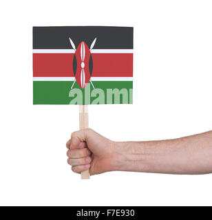Hand, die kleine Karte, isoliert auf weiss - Flagge Kenia Stockfoto