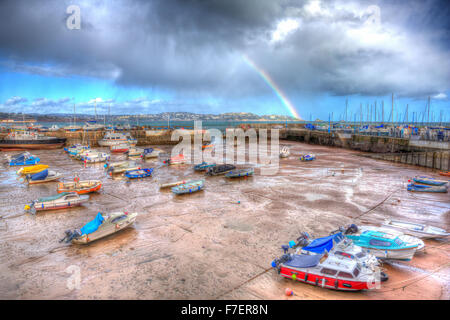 Regenbogen-English harbour Paignton Devon England uk in bunte HDR mit Booten bei Ebbe und Blick nach Torquay Stockfoto