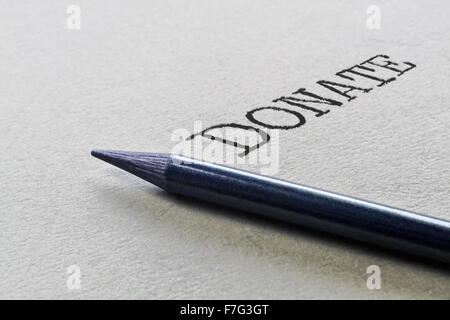 Graphitstift und handgeschriebene Wort Spenden Stockfoto