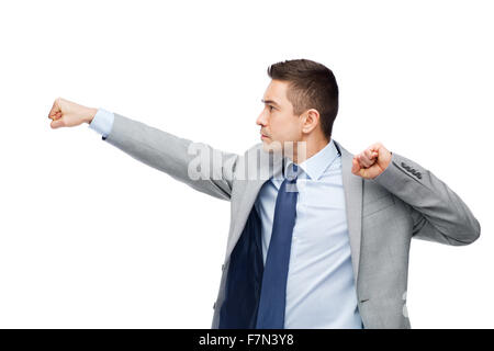 Geschäftsmann im Anzug mit jemandem kämpfen Stockfoto