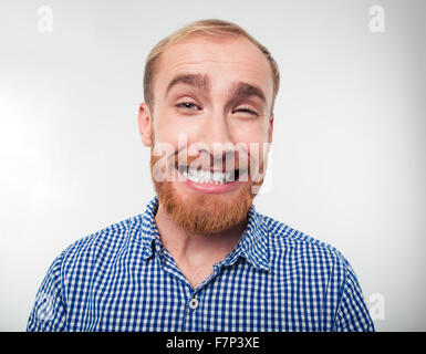 Porträt eines lustigen Lächeln isoliert auf weißem Hintergrund Stockfoto