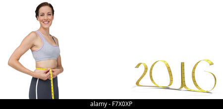 Zusammengesetztes Bild Porträt einer Fit Frau messen Taille Stockfoto