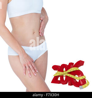 Zusammengesetztes Bild der hübsche Blondine ihren Bauch zu berühren Stockfoto