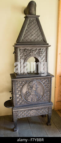 Eleganten antiken gusseisernen Holzofen Ofen in der Kongsvold Hotel in Oppland Mittelnorwegen Stockfoto