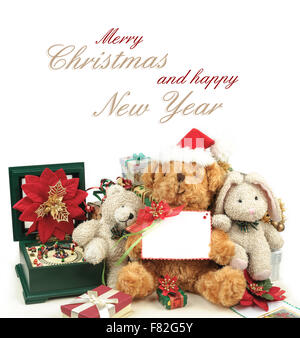 Weihnachtsgrußkarte mit Teddybären, Spielzeug & Geschenke, Text Frohe Weihnachten und Happy New Year und Leerraum Karte Stockfoto