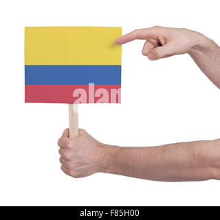 Hand, die kleine Karte, isoliert auf weiss - Flagge Kolumbien Stockfoto