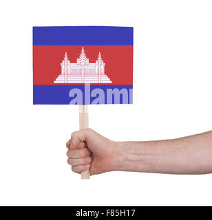 Hand, die kleine Karte, isoliert auf weiss - Flagge Kambodschas Stockfoto