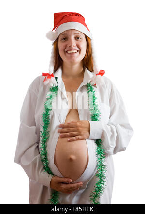 Schwangere Frau in Weihnachten Kleidung über weiß Stockfoto