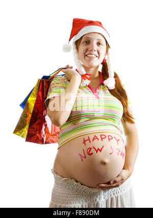 Schwangere Frau in Weihnachten Kleidung Einkaufstaschen über weiß zu halten Stockfoto