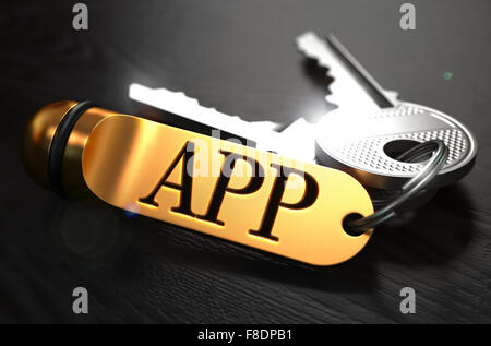 APP-Konzept. Tasten mit goldenen Schlüsselanhänger. Stockfoto