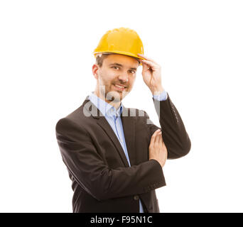 Junger Ingenieur mit gelben Helm ist isoliert auf weißem Hintergrund. Stockfoto