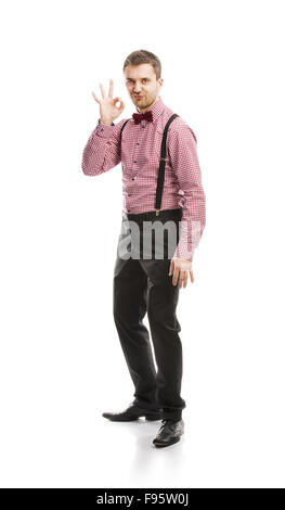 Funny Business Mann posiert im Studio mit Fliege und Hosenträger Stockfoto