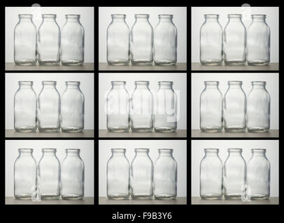 Kiste von Milchflaschen.   27 Glasflaschen Milch in Kiste.  Sich wiederholendes Muster, schwarze Ränder. Stockfoto
