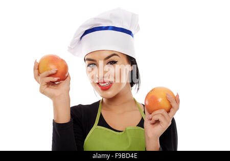 Junge Frau Koch hält zwei Grapefruit Obst Stockfoto
