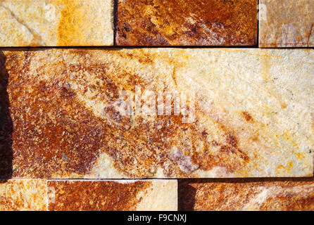 Stein Wand Textur. Ocker Hintergrund Stockfoto