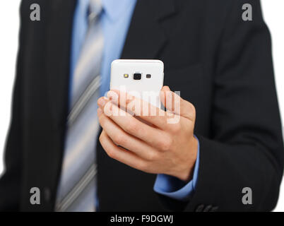 Junge Geschäftsfrau zeigt weiße Handy isoliert auf weißem Hintergrund Stockfoto
