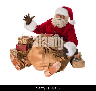 Santa Claus mit seiner großen Tasche voller Geschenke und Spielzeug voller Portrait sitzen Stockfoto