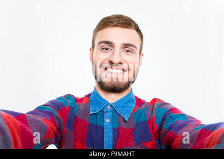 Selfie Foto von glücklich lächelnd bärtiger jungen Kerl im karierten Hemd Stockfoto