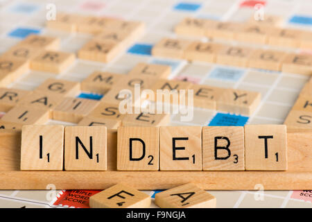Scrabble - Schulden Stockfoto