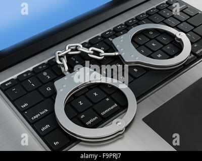 Handschellen auf Laptop-Computer-Tastatur Stockfoto