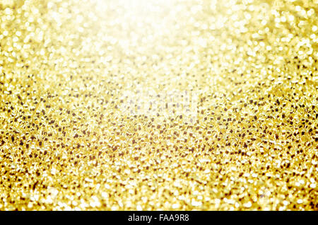 Weihnachten Golden glitzernden Hintergrund. Holiday Gold abstrakte Textur. Bokeh Stockfoto