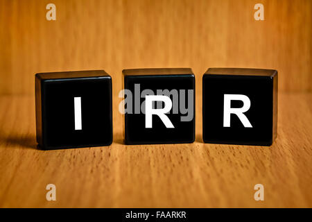 internal rate of return text on black block Stockfoto