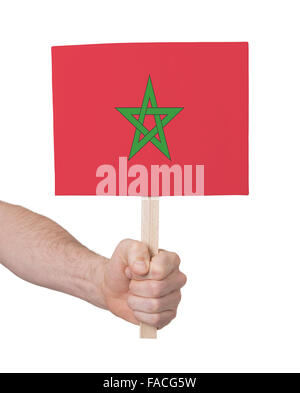 Hand, die kleine Karte, isoliert auf weiss - Flagge von Marokko Stockfoto