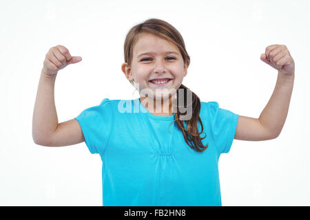 Niedliche Mädchen zeigt Bizeps Stockfoto