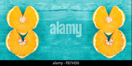 Hintergrund mit Herz Form orange Scheiben, Platz für Text. Stockfoto