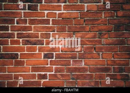 Rustikale orange Lehmziegel arbeiten Wandbeschaffenheit, städtischen Hintergrund Stockfoto