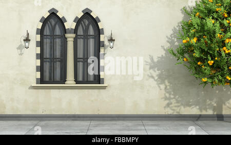 Alte Fassade mit zweibogigen gotische schwarze Fenster mit steinernen Rahmen und Spalte-3D Rendering Stockfoto