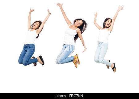 3 indische schöne junge Womans Jumping Stockfoto