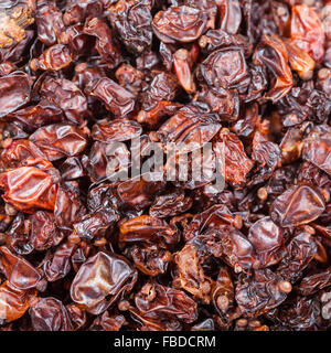 quadratische Essen Hintergrund - Trockenfrüchte viele rot berberis Stockfoto