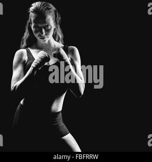 Zusammengesetztes Bild Porträt Sportlerin mit der Bekämpfung von Haltung Stockfoto