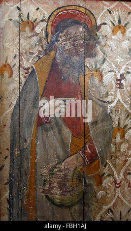 Gemalter Heiliger auf der Rood-Leinwand, St. Philip hält ein Brot, viel durch Ikonoklasten verunreinigt, St. Michael's Church, Irstead, Norfolk Stockfoto