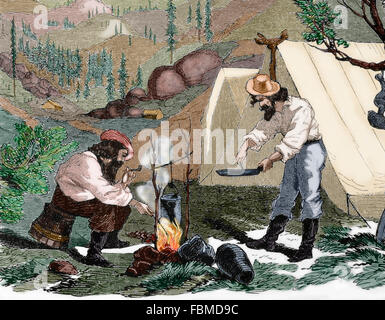 USA. Gold Rush. des 19. Jahrhunderts. Goldsucher Kochen im Lager bei Nacht. Gravur auf "Harpers Weekly", 1857. Farbige. Stockfoto