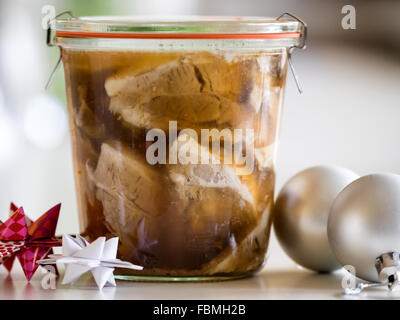 Eingelegte Weihnachten Schweinefleisch im Glas Stockfoto