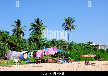 Waschtag am Strand Stockfoto