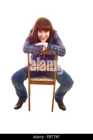 Frau auf Stuhl sitzend. Stockfoto