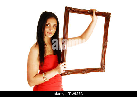 Schöne Mädchen im roten Kleid. Stockfoto