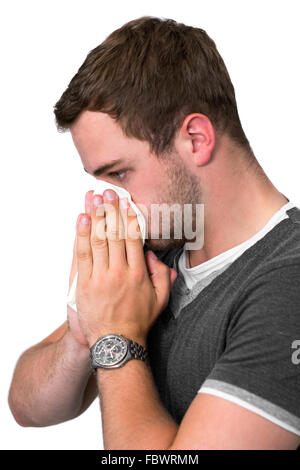 Junger Mann bläst Nase Stockfoto